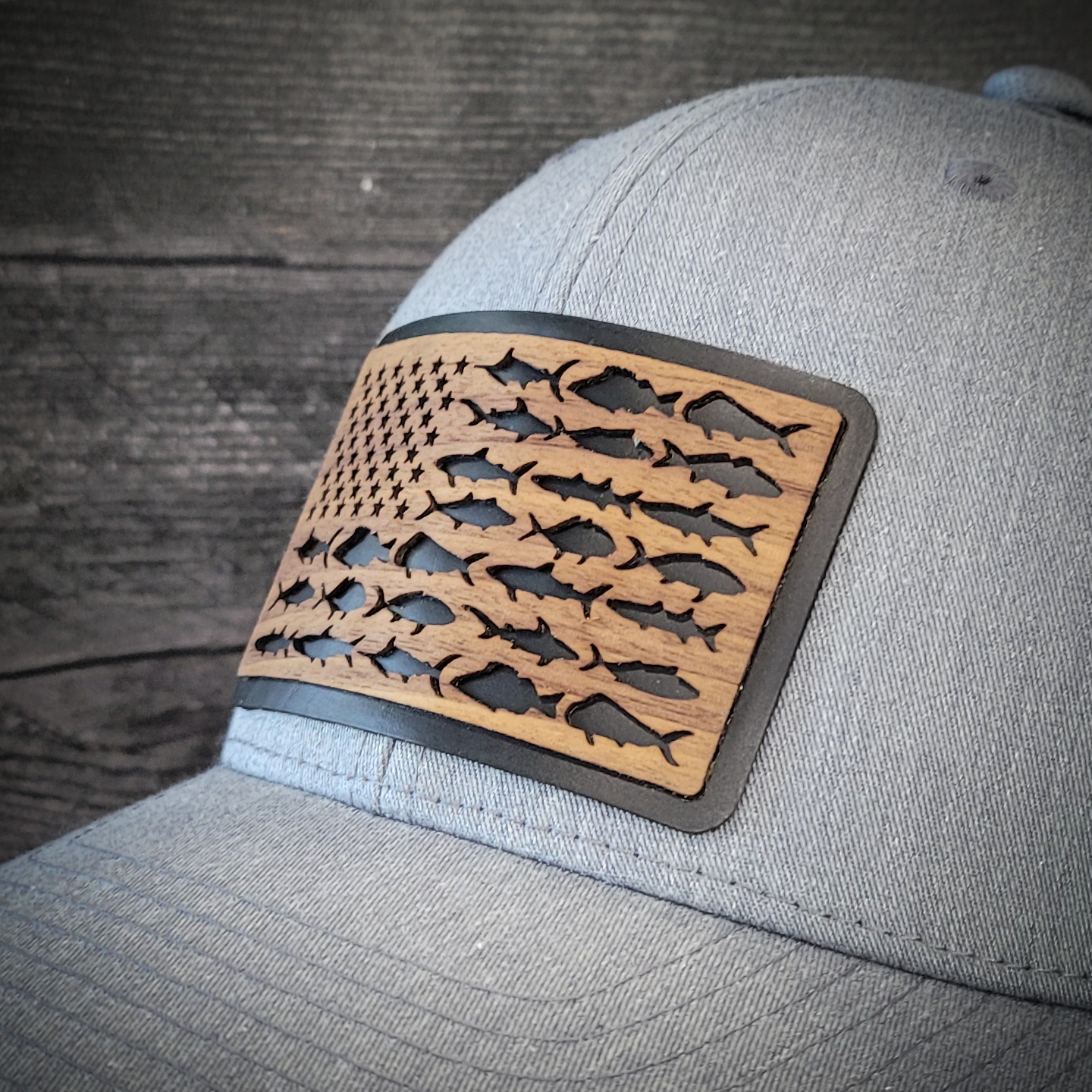 🎣 The American Angler – Wooden Patch Trucker Hat